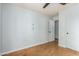 Simple bedroom with cork flooring and white walls at 4430 E Graythorn St, Phoenix, AZ 85044