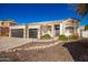 Two-story house with stone accents and a three-car garage at 4430 E Graythorn St, Phoenix, AZ 85044