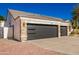 House exterior showcasing a three-car garage and stone detailing at 4430 E Graythorn St, Phoenix, AZ 85044