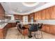 Modern kitchen with granite countertops and island at 4430 E Graythorn St, Phoenix, AZ 85044