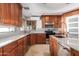 Updated kitchen, featuring corner sink and ample cabinetry at 4430 E Graythorn St, Phoenix, AZ 85044