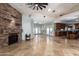 Open living space featuring a stone fireplace and tile floors at 4430 E Graythorn St, Phoenix, AZ 85044