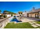 Stunning pool and expansive patio with seating at 4430 E Graythorn St, Phoenix, AZ 85044