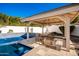 Outdoor kitchen and bar perfect for entertaining at 4430 E Graythorn St, Phoenix, AZ 85044