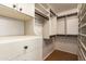 Large walk-in closet with ample shelving and hanging space at 4430 E Graythorn St, Phoenix, AZ 85044