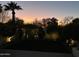 Landscaped backyard at dusk with lush greenery and lighting at 4666 N 40Th St, Phoenix, AZ 85018