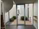 Glass entry door and hallway view leading to courtyard at 4666 N 40Th St, Phoenix, AZ 85018