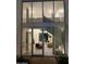 Modern entryway with glass doors offering a view of the interior living space and spiral staircase at 4666 N 40Th St, Phoenix, AZ 85018