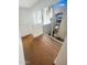 Light-filled hallway with wood floors and view to exterior at 4666 N 40Th St, Phoenix, AZ 85018