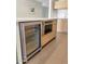 Modern kitchen island with built-in wine cooler and oven at 4666 N 40Th St, Phoenix, AZ 85018