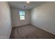 Spacious bedroom with neutral carpeting and a window with blinds at 47489 W Kenner Dr, Maricopa, AZ 85139