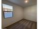 Simple bedroom with neutral carpet and a window at 47489 W Kenner Dr, Maricopa, AZ 85139