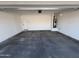 Spacious two-car garage with concrete floor at 47489 W Kenner Dr, Maricopa, AZ 85139