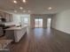 Open living room with kitchen and backyard access at 47489 W Kenner Dr, Maricopa, AZ 85139