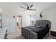 Guest bedroom with gray upholstered bed at 47558 W Mellen Ln, Maricopa, AZ 85139