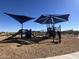 playground with shade structures and play equipment at 47558 W Mellen Ln, Maricopa, AZ 85139