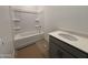 Clean bathroom with a tub, shower, and gray vanity at 47762 W Moeller Rd, Maricopa, AZ 85139