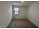 Bright bedroom with neutral walls and carpeted floors at 47762 W Moeller Rd, Maricopa, AZ 85139