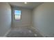 Simple bedroom with new flooring and a window at 47762 W Moeller Rd, Maricopa, AZ 85139