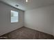 Bright bedroom with neutral walls and carpeted floors at 47762 W Moeller Rd, Maricopa, AZ 85139