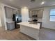 Modern kitchen with gray cabinets, quartz countertops, and island at 47762 W Moeller Rd, Maricopa, AZ 85139