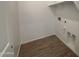 Laundry room with wood-look tile flooring and shelving at 47762 W Moeller Rd, Maricopa, AZ 85139