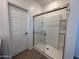 Clean shower with glass enclosure and built-in shelving at 47762 W Moeller Rd, Maricopa, AZ 85139