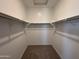 Spacious walk-in closet with double hanging rods at 47762 W Moeller Rd, Maricopa, AZ 85139