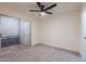 Bedroom with patio access and ceiling fan at 501 W Yukon Dr # 8, Phoenix, AZ 85027