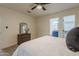 Bright bedroom with dresser, ensuite bathroom access, and walk-in closet at 501 W Yukon Dr # 8, Phoenix, AZ 85027