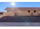 Tan stucco building exterior with a tiled roof and parking at 501 W Yukon Dr # 8, Phoenix, AZ 85027