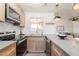 Modern kitchen with light wood cabinets, stainless steel appliances, and gray countertops at 501 W Yukon Dr # 8, Phoenix, AZ 85027