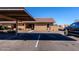 Parking spot with a covered carport and view of the building at 501 W Yukon Dr # 8, Phoenix, AZ 85027