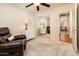 Bedroom with recliner, dresser, and view into another room at 5226 S 15Th St, Phoenix, AZ 85040