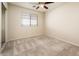 Spacious bedroom with carpeted floors and a window at 5226 S 15Th St, Phoenix, AZ 85040