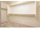 Walk-in closet with ample shelving and hanging space at 5226 S 15Th St, Phoenix, AZ 85040