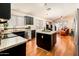 Kitchen with dark cabinets, granite countertops, and island at 5226 S 15Th St, Phoenix, AZ 85040