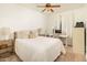 Bright bedroom with a queen bed and built-in desk at 5350 E Deer Valley Dr # 4434, Phoenix, AZ 85054