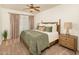 Spacious bedroom with king-size bed and wood nightstand at 5350 E Deer Valley Dr # 4434, Phoenix, AZ 85054