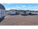 View of backyard, showing the house exterior and shed at 5490 E Boise St, Mesa, AZ 85205