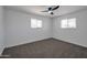 Spacious bedroom with gray carpet and ceiling fan at 5490 E Boise St, Mesa, AZ 85205