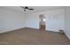 Spacious bedroom with hardwood floors and ceiling fan at 5490 E Boise St, Mesa, AZ 85205