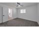 Bright bedroom with gray carpet and en-suite bathroom at 5490 E Boise St, Mesa, AZ 85205