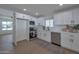 Modern kitchen with white shaker cabinets and stainless steel appliances at 5490 E Boise St, Mesa, AZ 85205