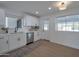 Modern kitchen with white shaker cabinets and stainless steel appliances at 5490 E Boise St, Mesa, AZ 85205