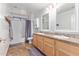 Bathroom with a bathtub, double vanity, and updated fixtures at 5720 W Robb Ln, Glendale, AZ 85310