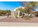 Two-story house with desert landscaping and a three-car garage at 5720 W Robb Ln, Glendale, AZ 85310