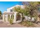 Two-story house with desert landscaping and a three-car garage at 5720 W Robb Ln, Glendale, AZ 85310