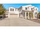 Two-story house with desert landscaping and a three-car garage at 5720 W Robb Ln, Glendale, AZ 85310