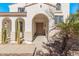 Front entrance with double doors and arched entryway at 5720 W Robb Ln, Glendale, AZ 85310